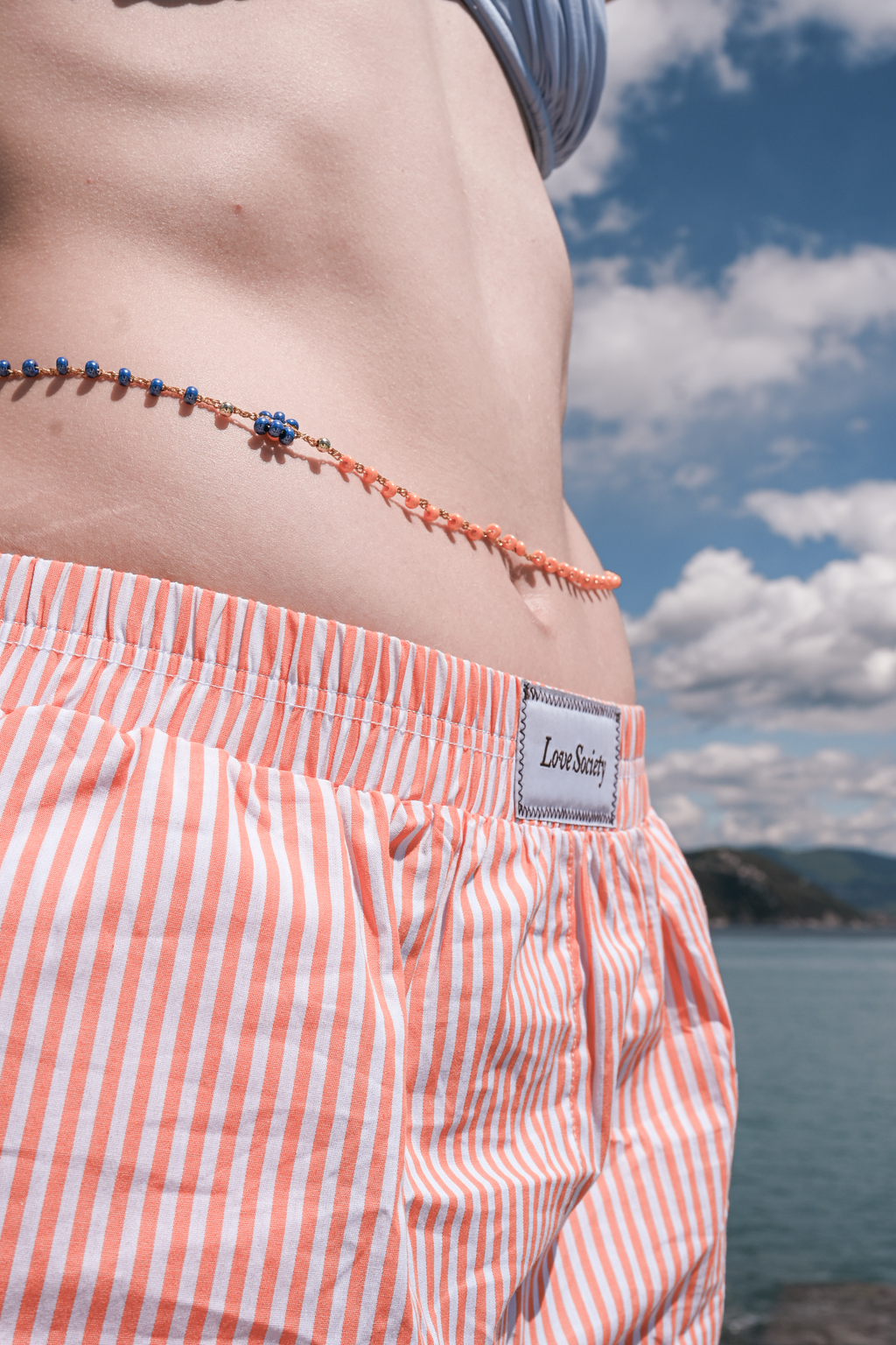 Orange striped shorts + Necklace